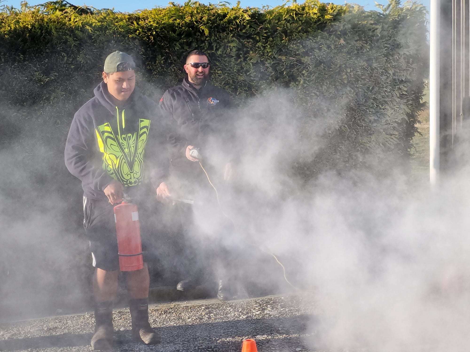 Kaloni Taylor using the CO2 extinguisher under the supervision of Daniel Munro.